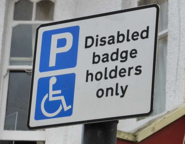 If you have a blue badge then you will be able to use spaces marked with this disabled badge holders sign