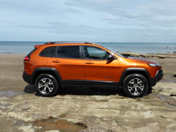 jeep on rocks on beach