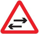 two-way-traffic-crosses-one-way-road-warning-sign