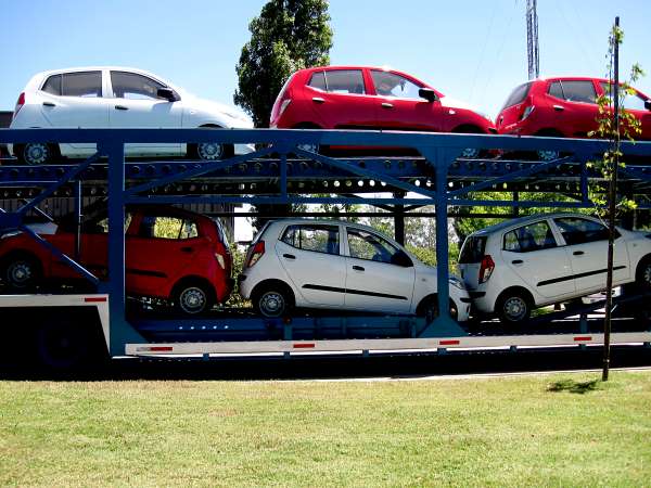 Cars waiting on a car transporter