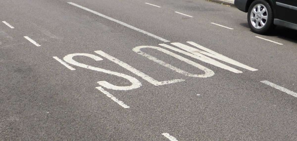 slow road marking