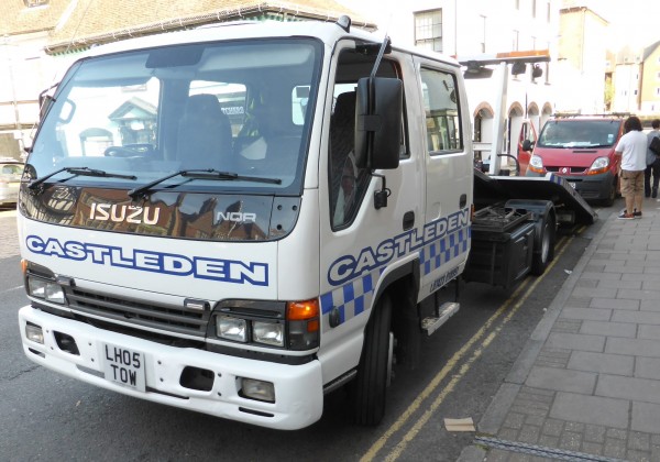 Tow truck collecting a broken down car